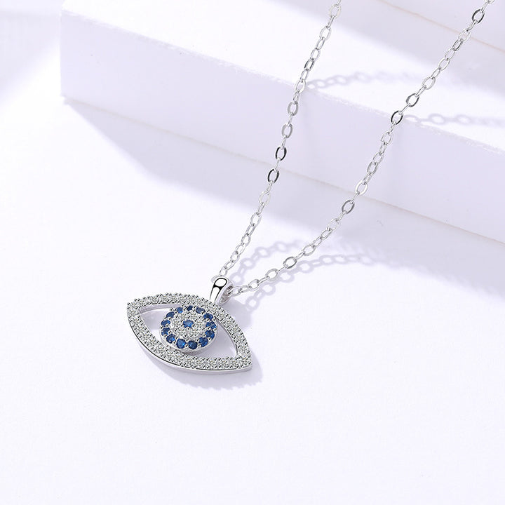 Silver evil eye pendant with blue stones