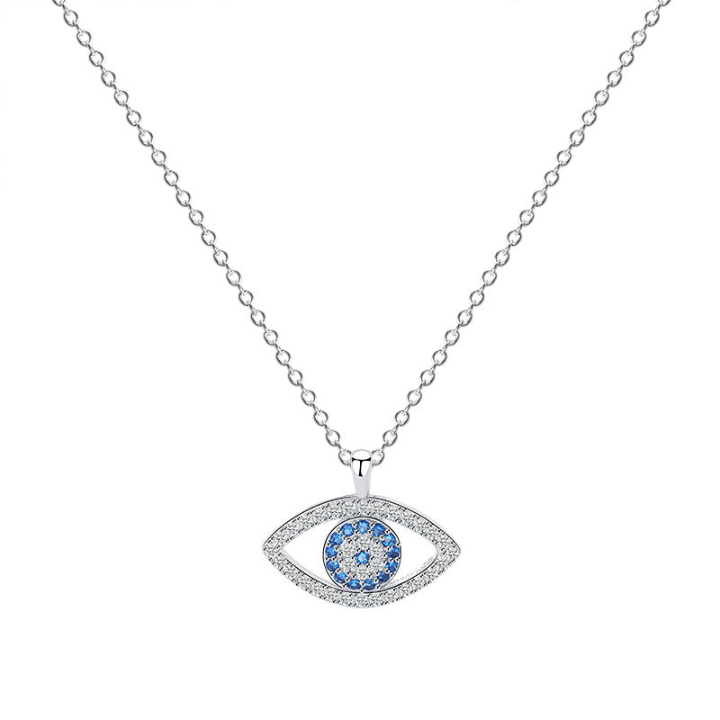 Silver evil eye pendant with blue stones