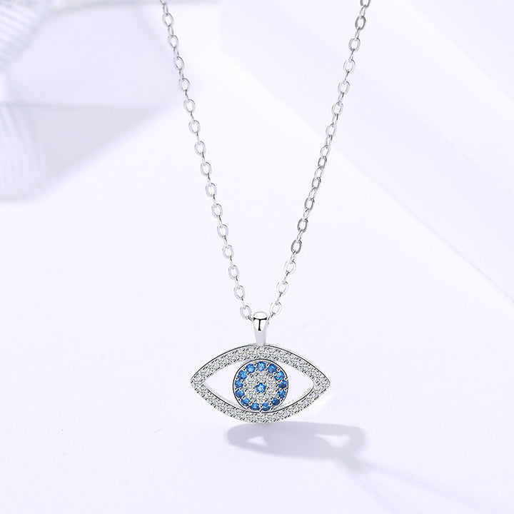 Silver evil eye pendant with blue stones
